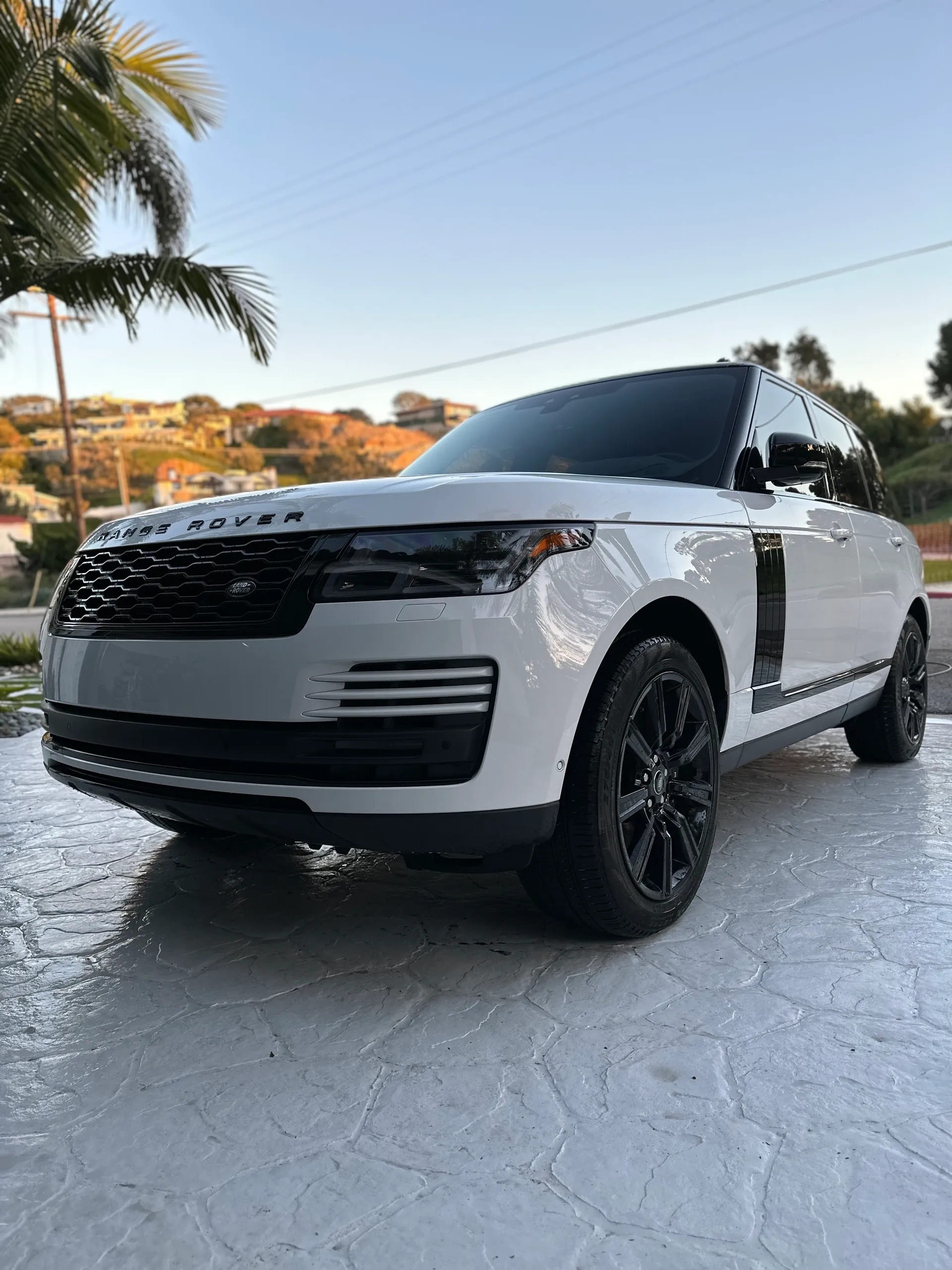 White Range Rover ceramic coated and parked outside.