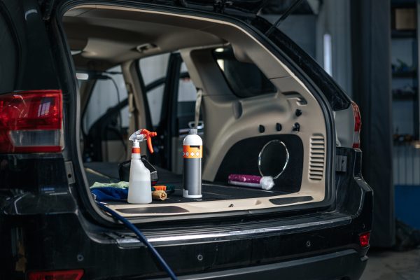Clean open empty car trunk in the car detailing service, close up